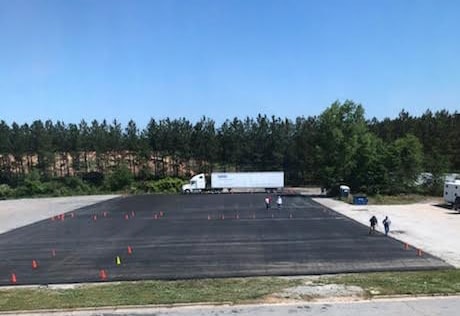 Katlaw CDL training yard with semi truck and orange cones